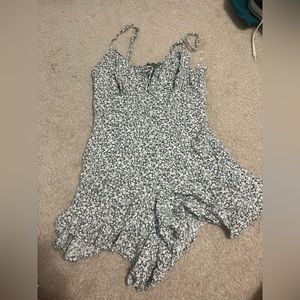 Green romper with adjustable straps